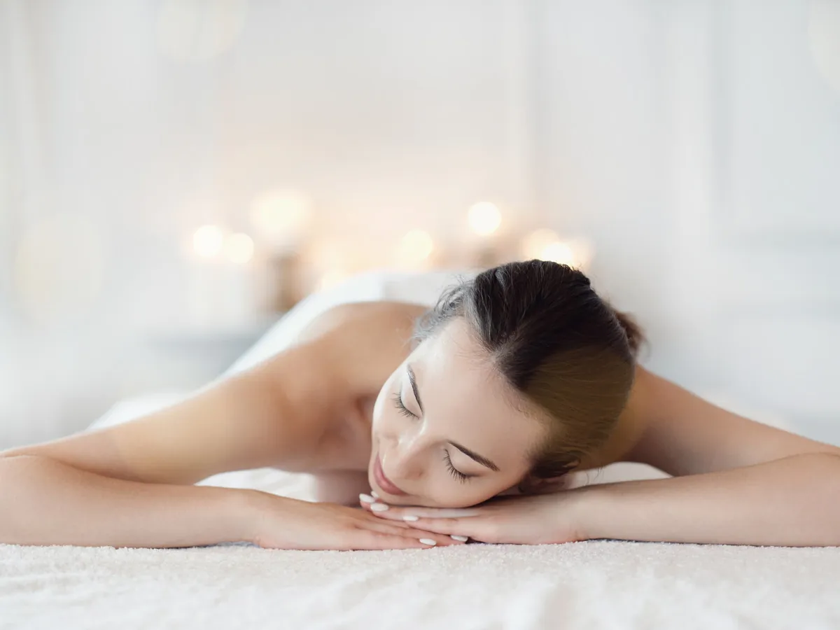 Calm, candlelit treatment setting at The Therapy Studio