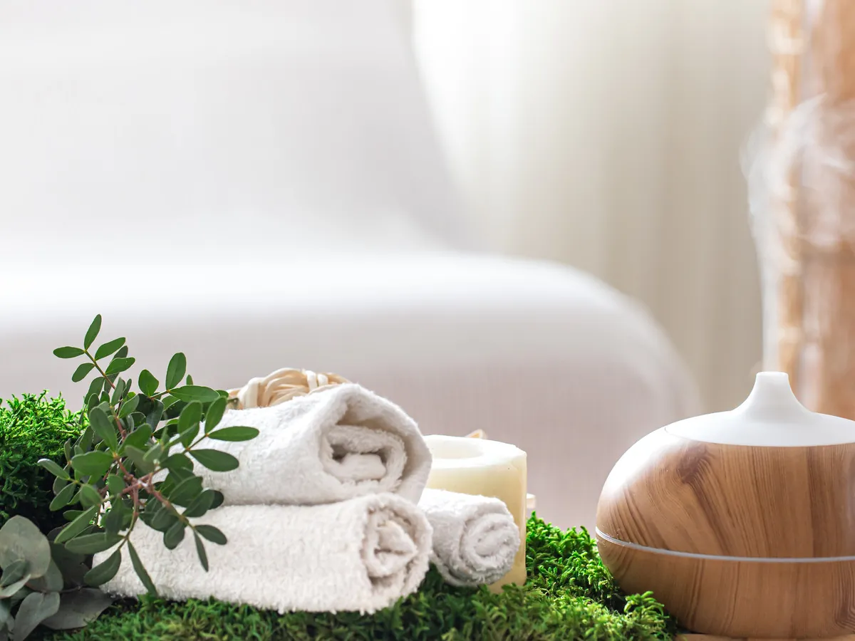 Fresh towels and candles laid out before a treatment
